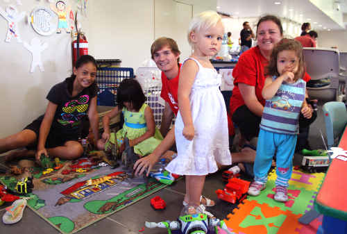 HAPPY CAMPERS: Save the Children’s Dean Wrobel and Frankie Buchanan with some of their mobile play centre guests. The children have been creating art that will be on display at council. sg-141101-004 HAPPY CAMPERS: Save the Children’s Dean Wrobel and Frankie Buchanan with some of their mobile play centre guests. The children have been creating art that will be on display at council. sg-141101-004